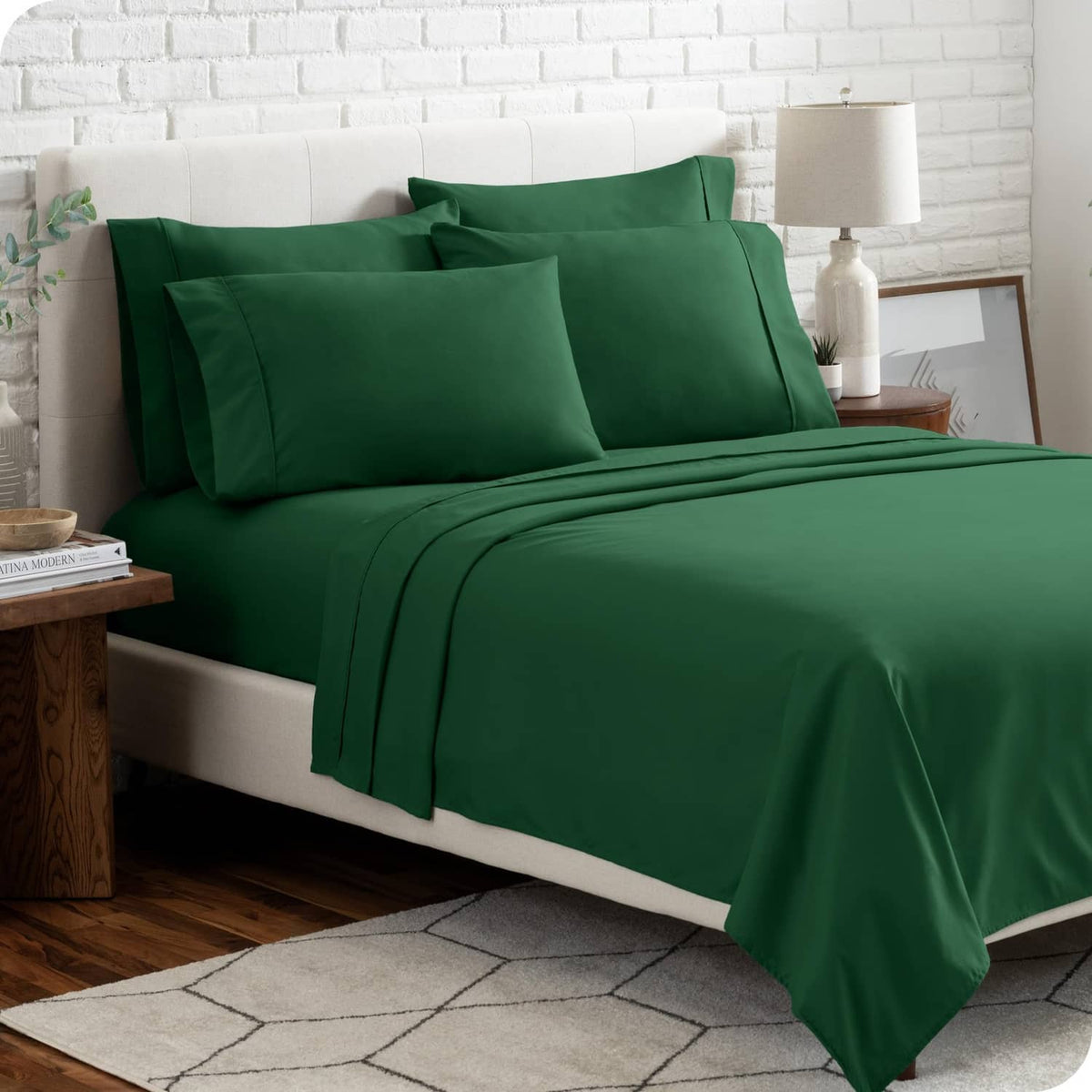 Forest green Twin XL bed sheet set on a made bed with two pillowcases