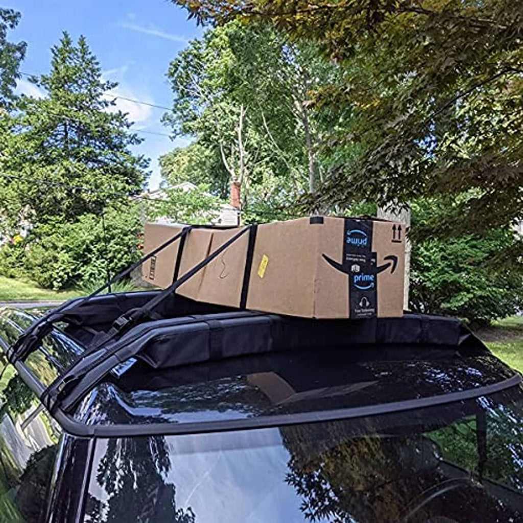Black roof rack pad covering mounted on a car roof with boxes on top