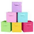 Stack of foldable fabric storage cubes with fabric handles, in assorted colors