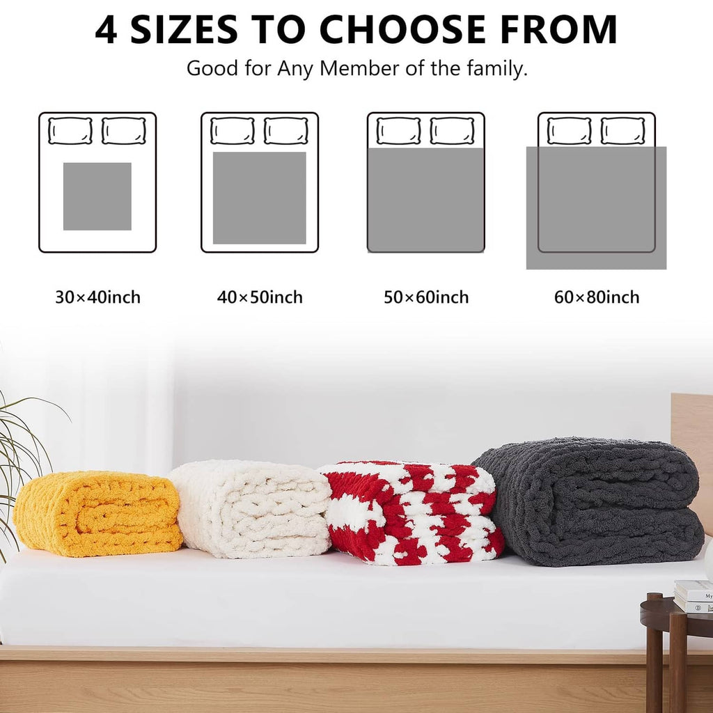 Stack of chunky knit throw blankets in multiple sizes and colors, folded