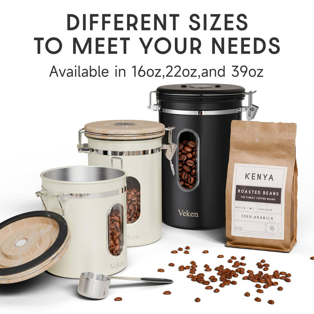 Set of cream and black stainless canisters with clear windows and hinged clamp lids