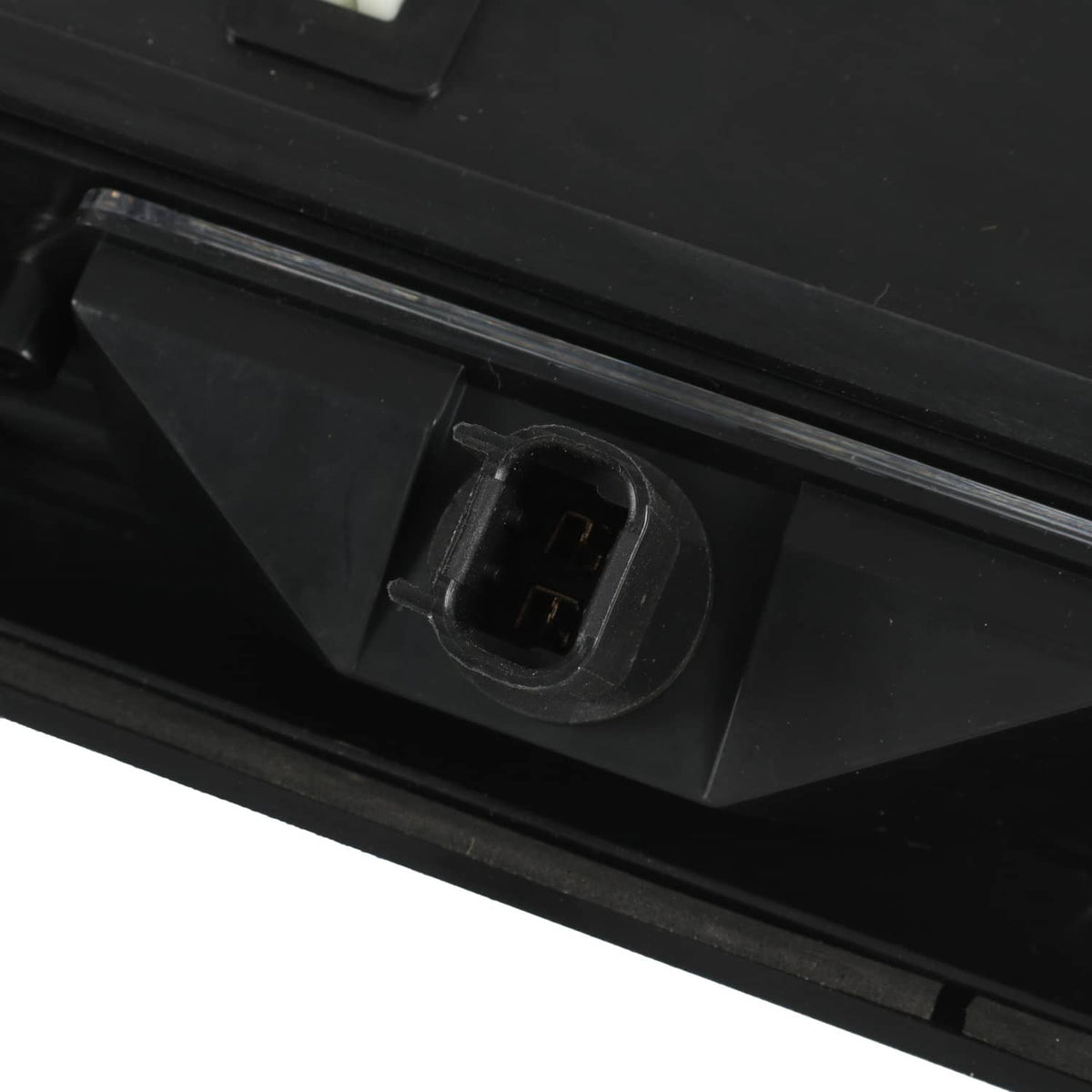 Rear tailgate license pocket mounting tab with rectangular opening, black plastic