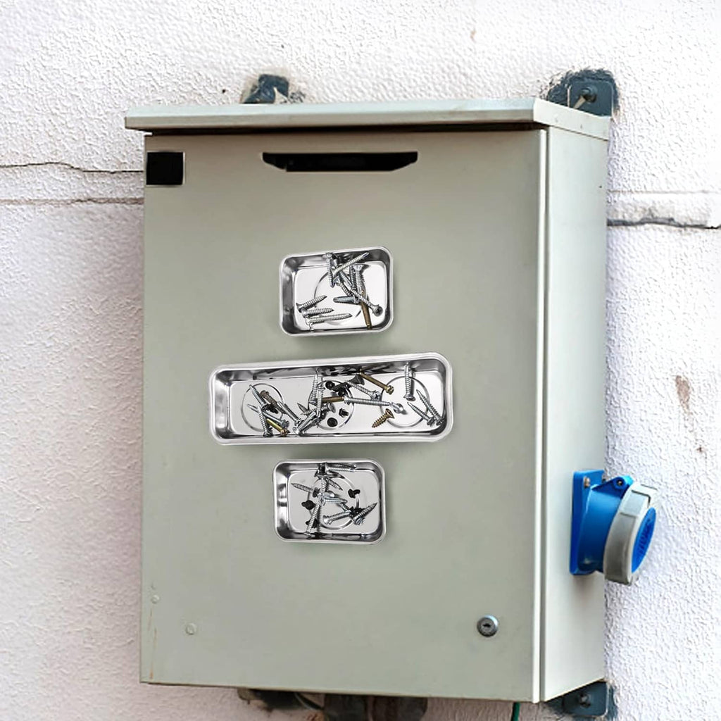 Stainless steel magnetic parts trays mounted on a panel, holding screws