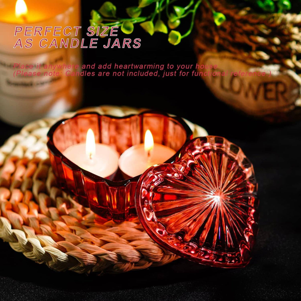 Red heart-shaped crystal jar with lid, holding a lit tealight candle