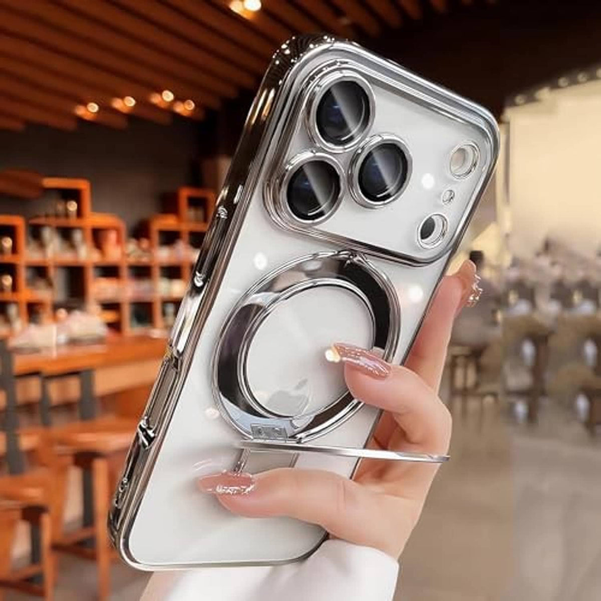 Silvery clear magnetic phone case with large circular kickstand ring and camera cutouts