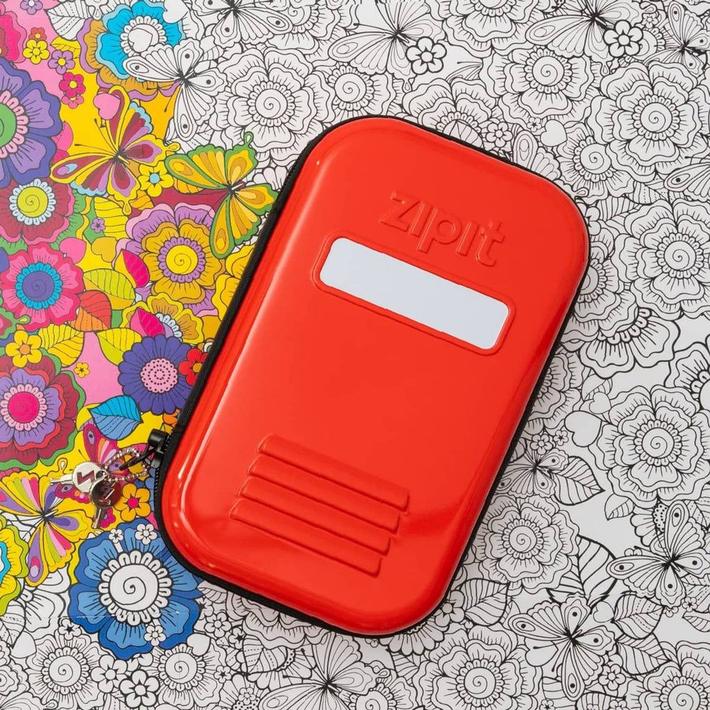 Red ZIPIT lockable tin pencil case with white label window and molded grip vents