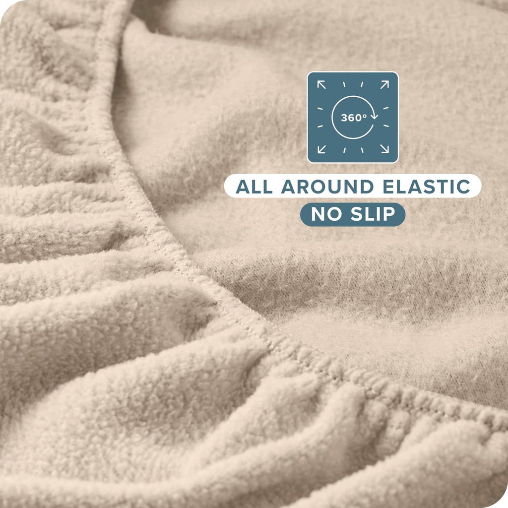 Plush fleece fitted bottom sheet with all-around elastic for a secure, no-slip hold.