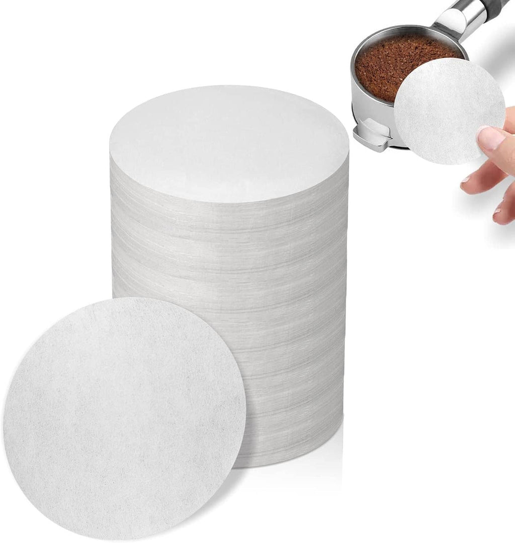 Unbleached round paper espresso filters, stacked white discs (53–54 mm)