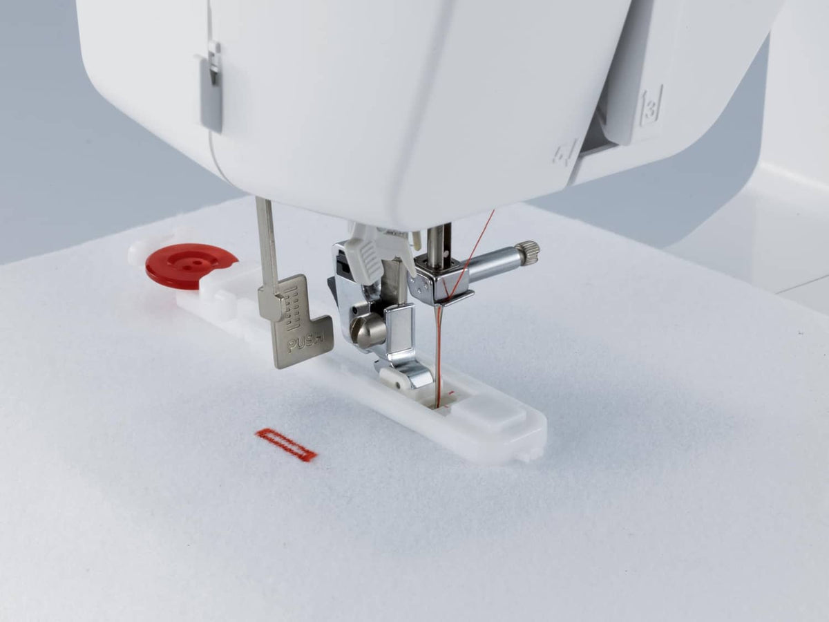 Close-up of presser foot and needle area with accessory feet