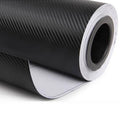 Black 3D carbon fiber twill film roll with metallic gray weave texture, unrolled edge