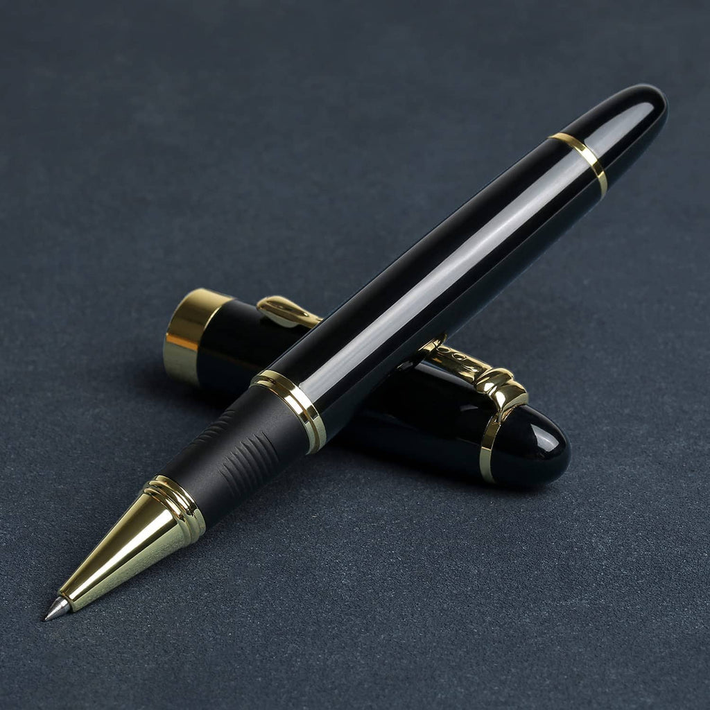 Black luxury ballpoint pen with gold clip and nib tip