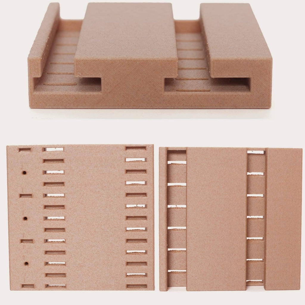 Brown molded tray insert with rectangular cutouts for organizing pieces