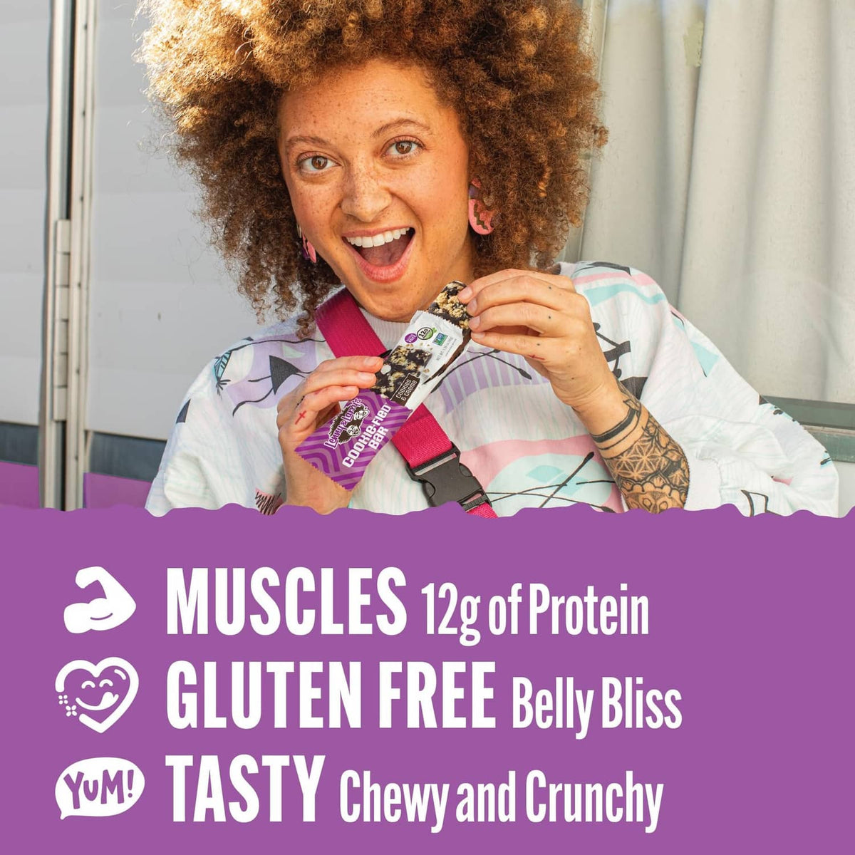 Person holding a gluten free cookie-fied protein bar wrapper, 12g protein label visible