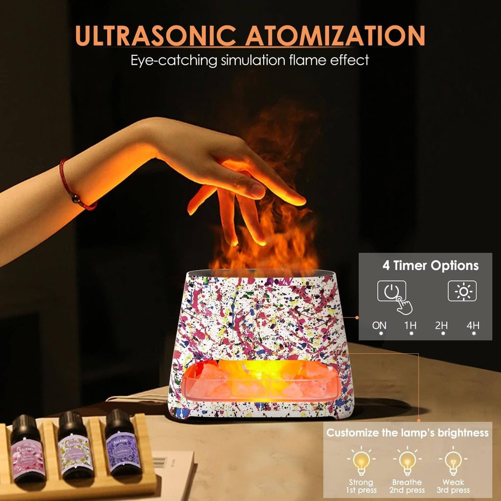 Splatter Himalayan salt lamp with glowing tray, with essential oil bottles nearby