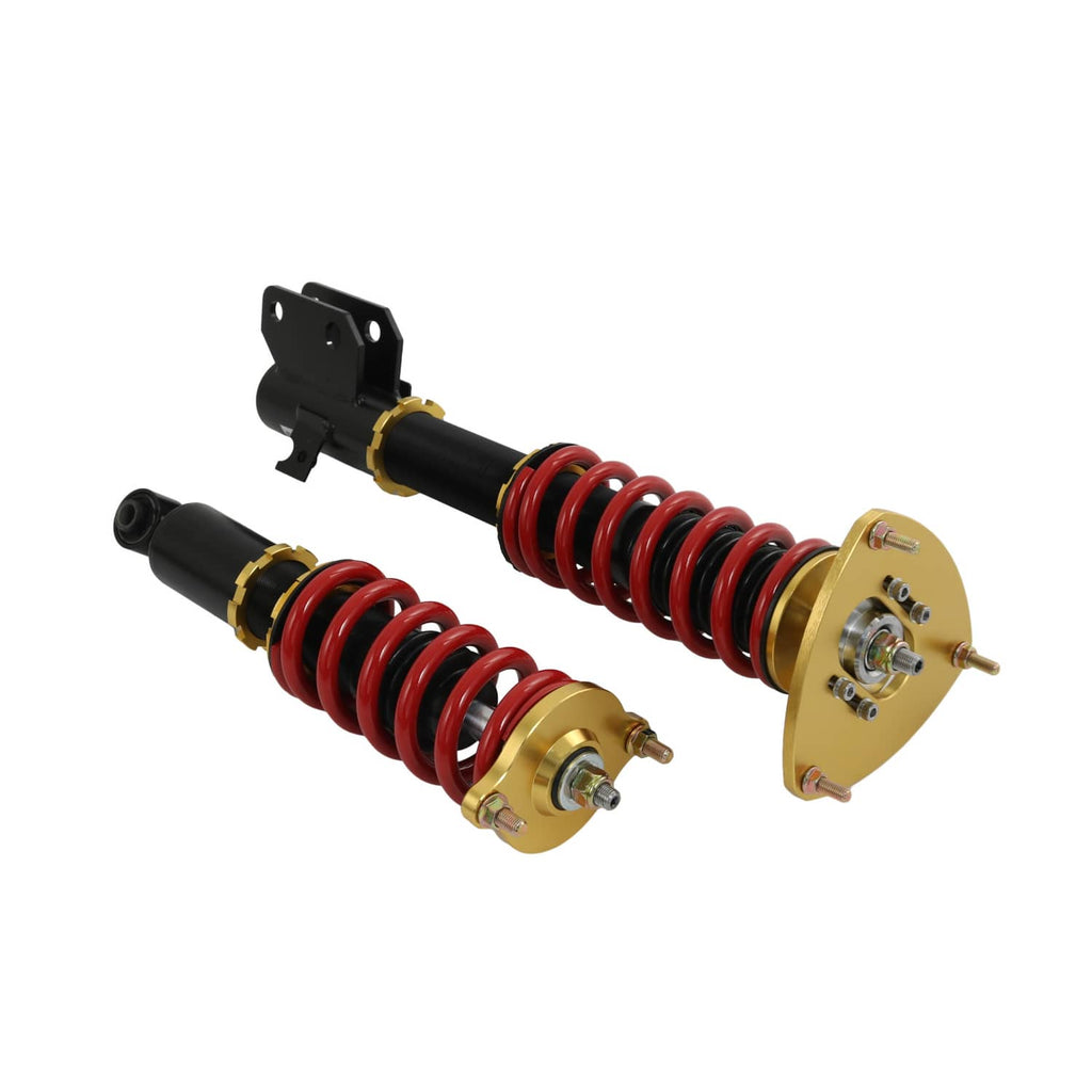 Two coilover struts with red springs and black shocks, shown with gold top plates