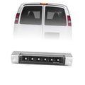 Third brake light with clear lens and black housing on white van, unlit