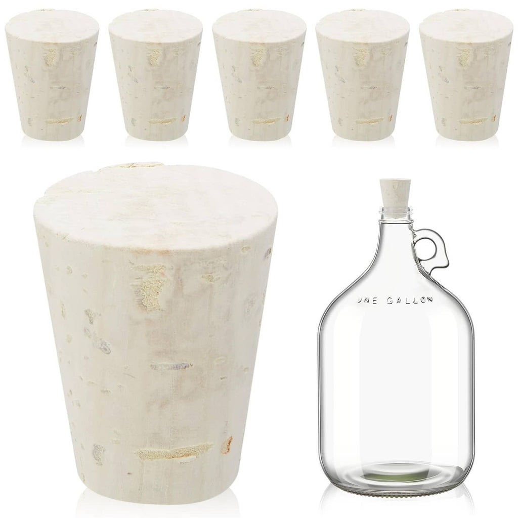 Light brown cork carboy stoppers and clear glass one-gallon bottle with cork cap