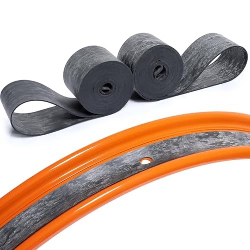 Motorcycle rim strip tape on orange wheel rim, dark rubber band with valve hole and rolls