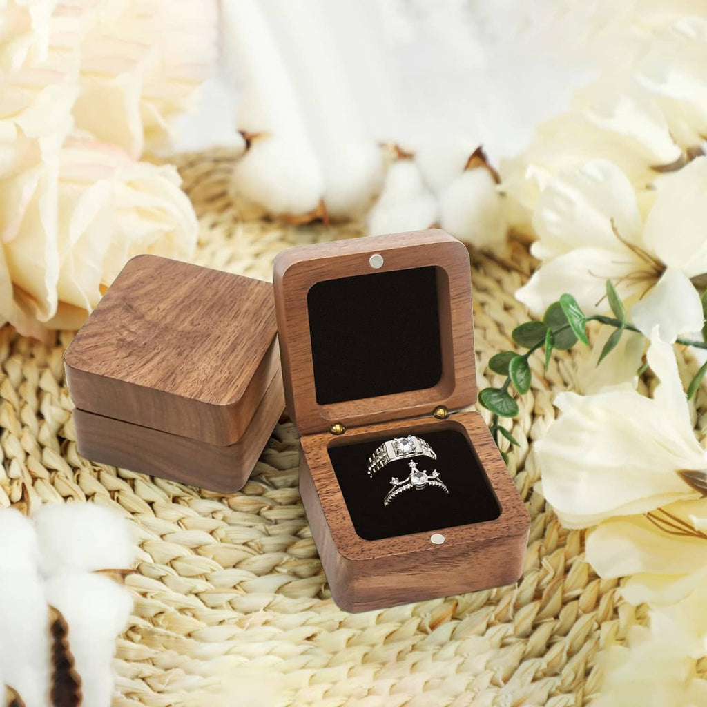 Wooden ring box with hinged lid open, two black velvet compartments for rings