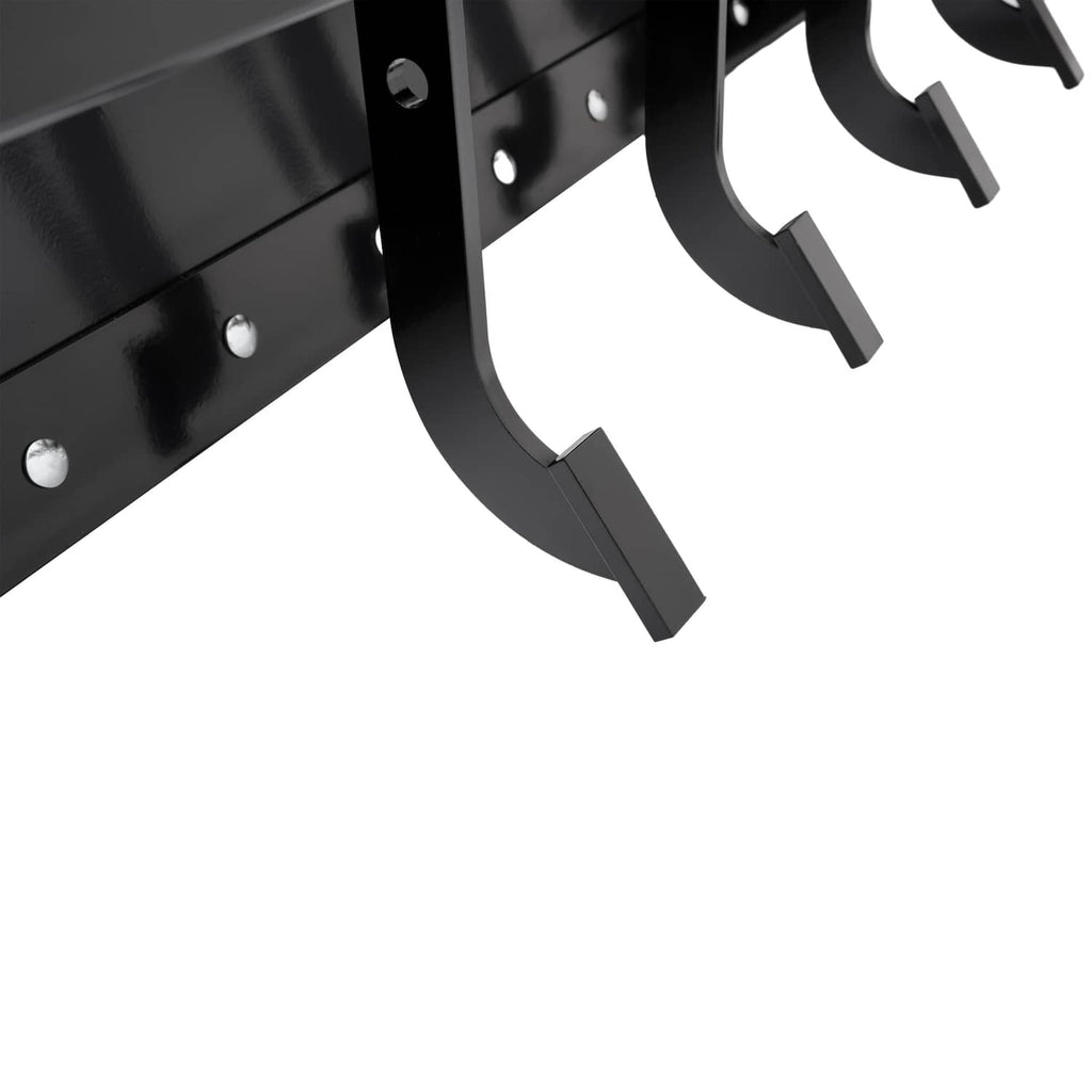 Close-up of black curved scraper blades and mounting plates on tow-behind box scraper