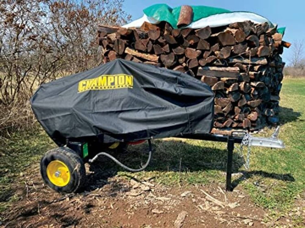 Black log splitter storage cover with Champion logo, used outdoors beside stacked logs
