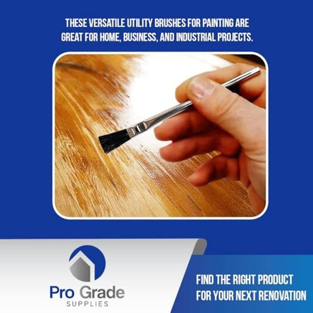 Hand holding acid brush with black bristles applying finish to a wood board.
