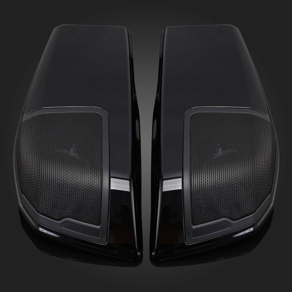 Close-up of two black saddlebag speaker lids with mesh grille panels