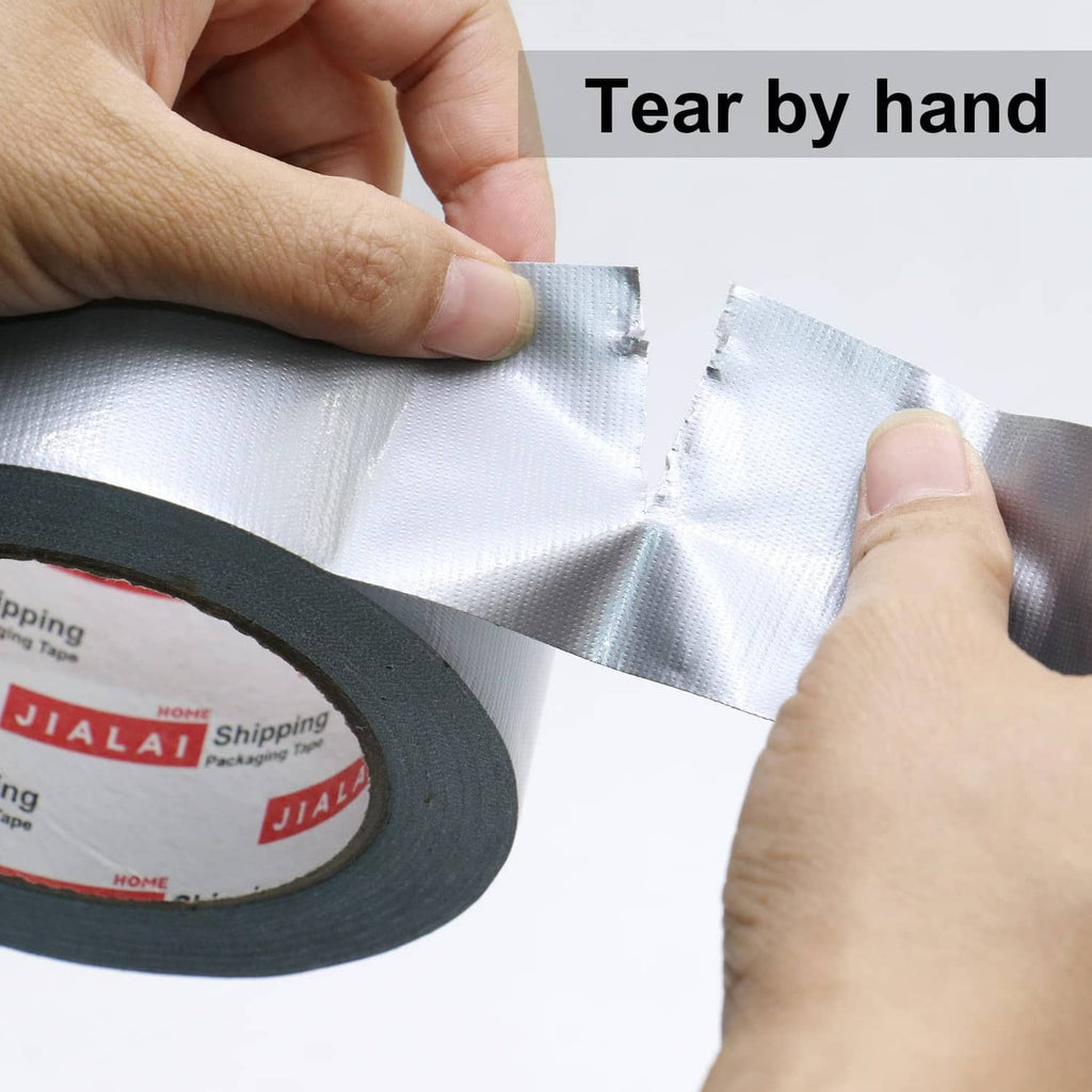 Silver duct tape with hands tearing a short section by hand from the roll.