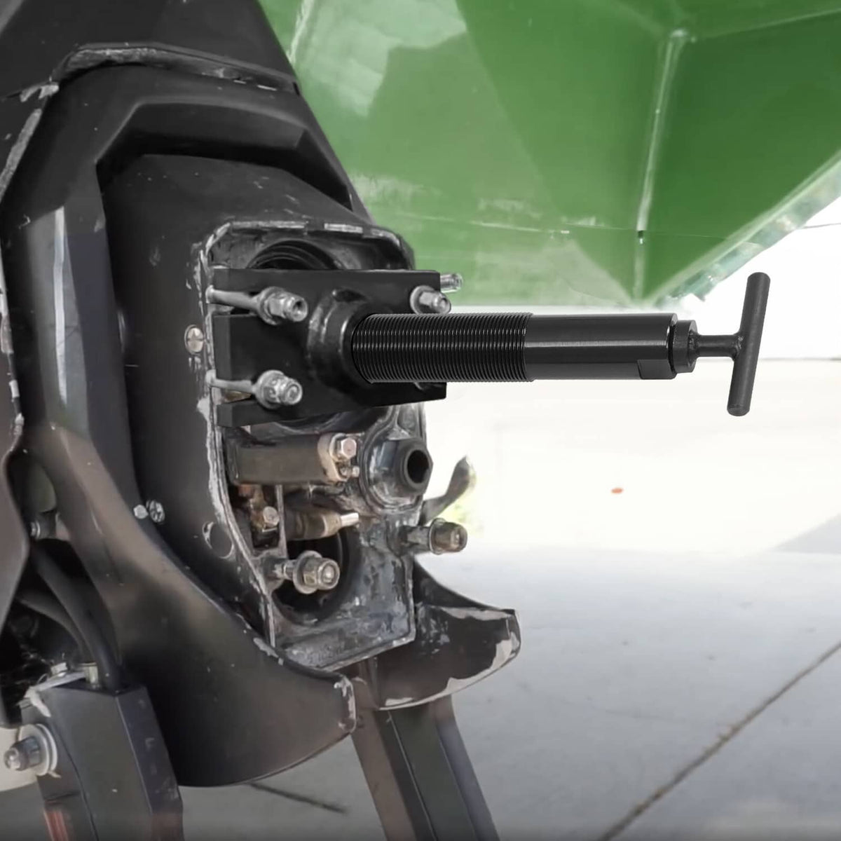 Bearing puller tool mounted on an outboard engine for gimbal bearing removal