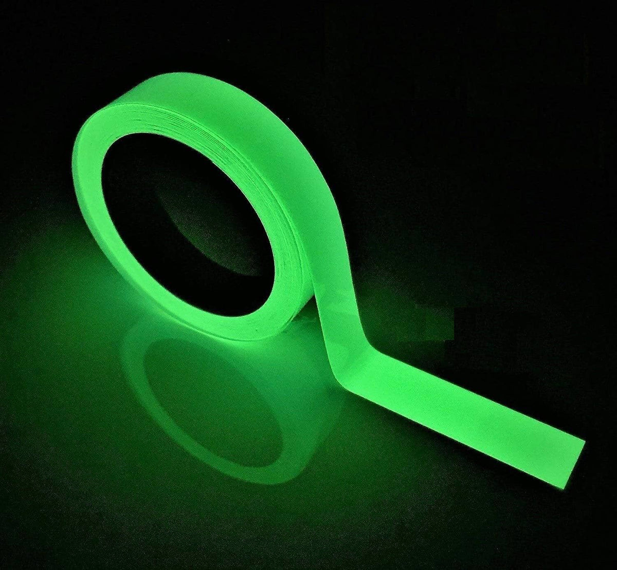 Fluorescent glow-in-the-dark adhesive tape roll with green strip, curled and laid out