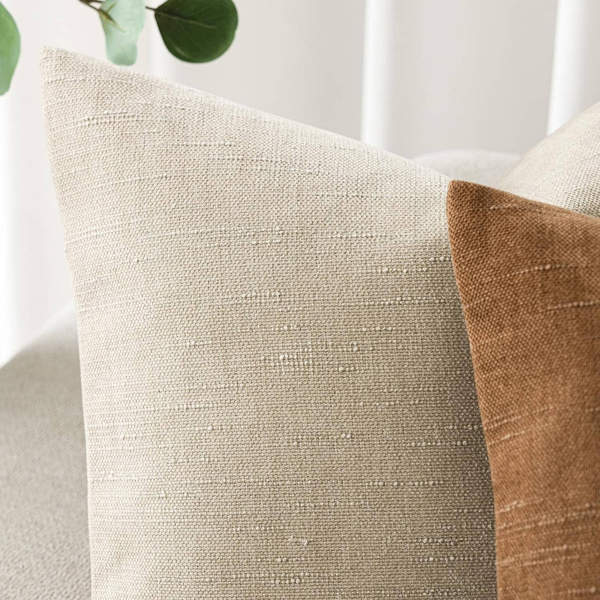 Textured cement chenille pillow front, light beige fabric with fine dot weave pattern.