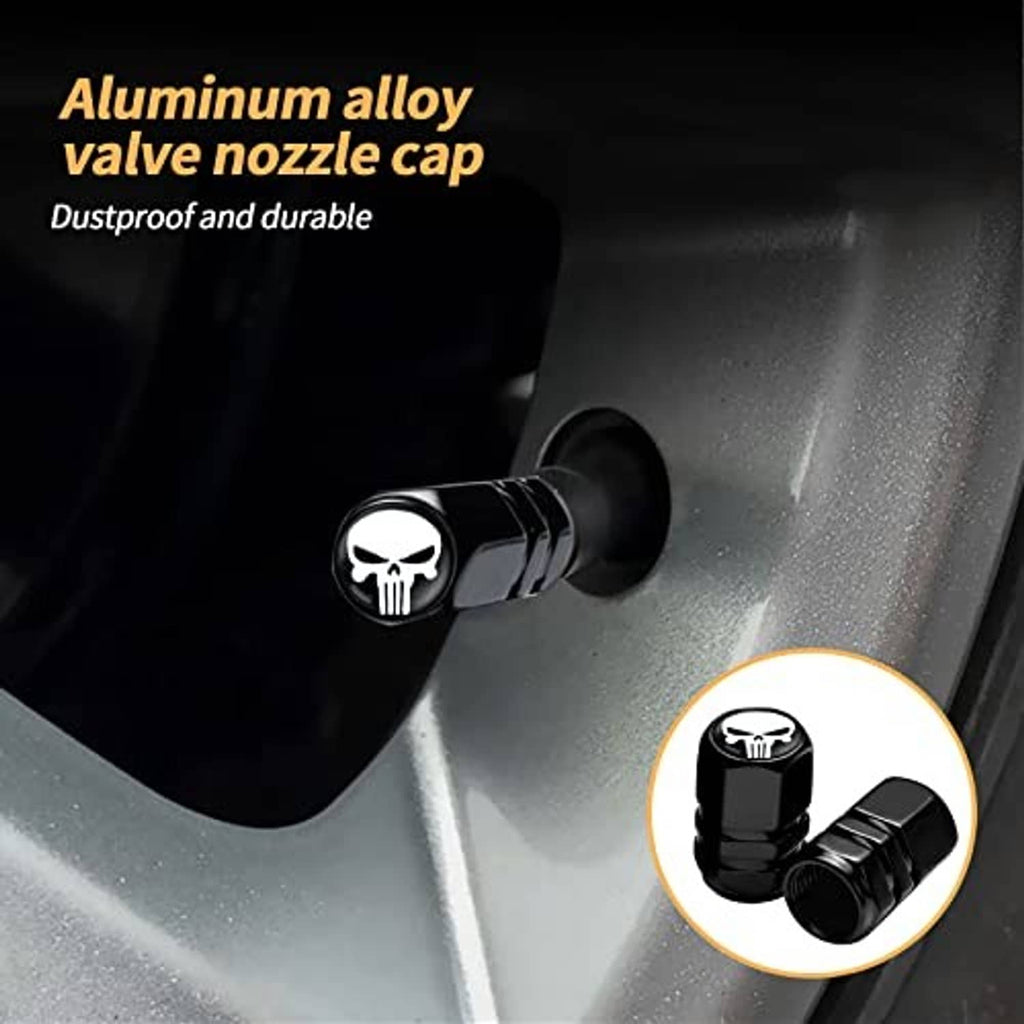 Black wheel valve stem cap with white skull emblem, metal-look dustproof cover
