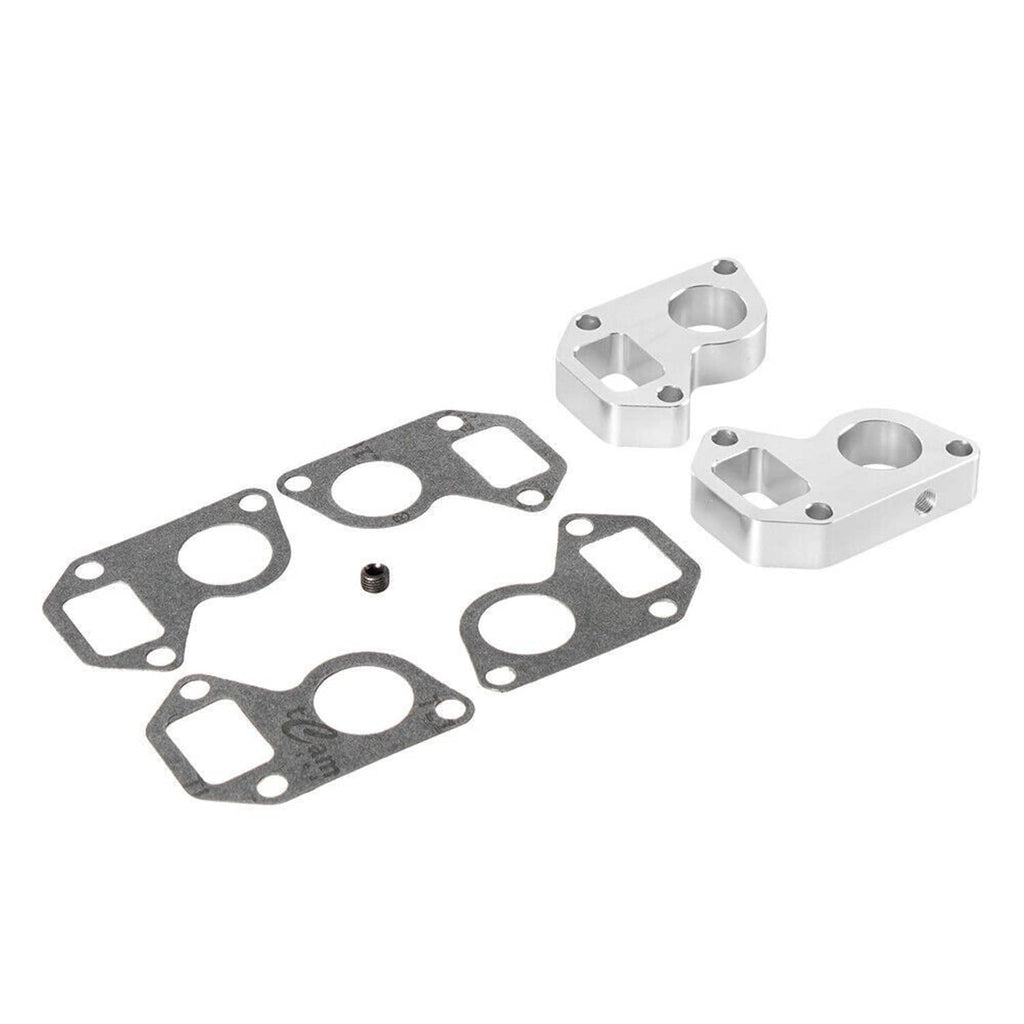 Water pump spacer adapter kit with several black gaskets and two silver spacer blocks
