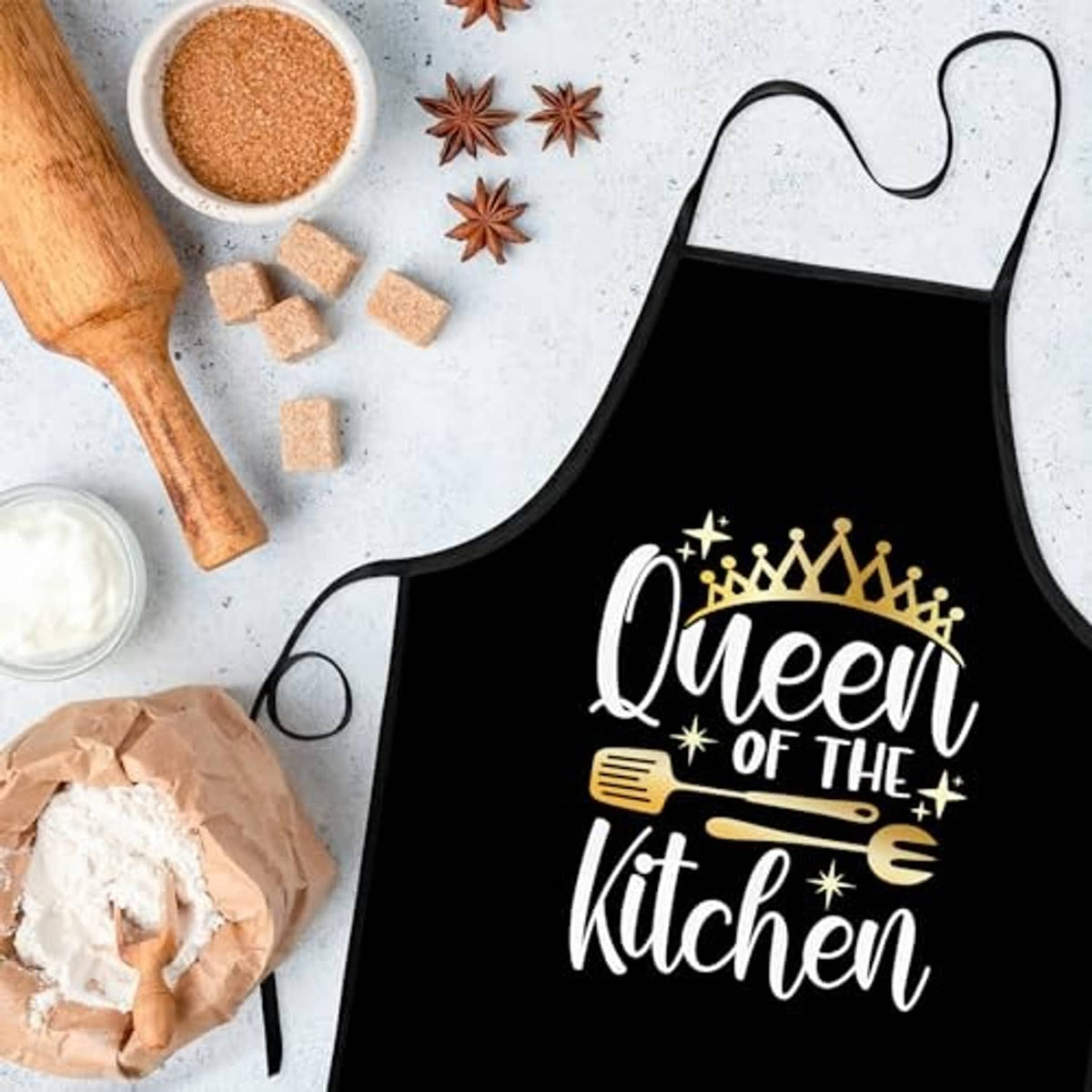 Black kitchen apron with front pocket and "Queen of the Kitchen" crown graphic