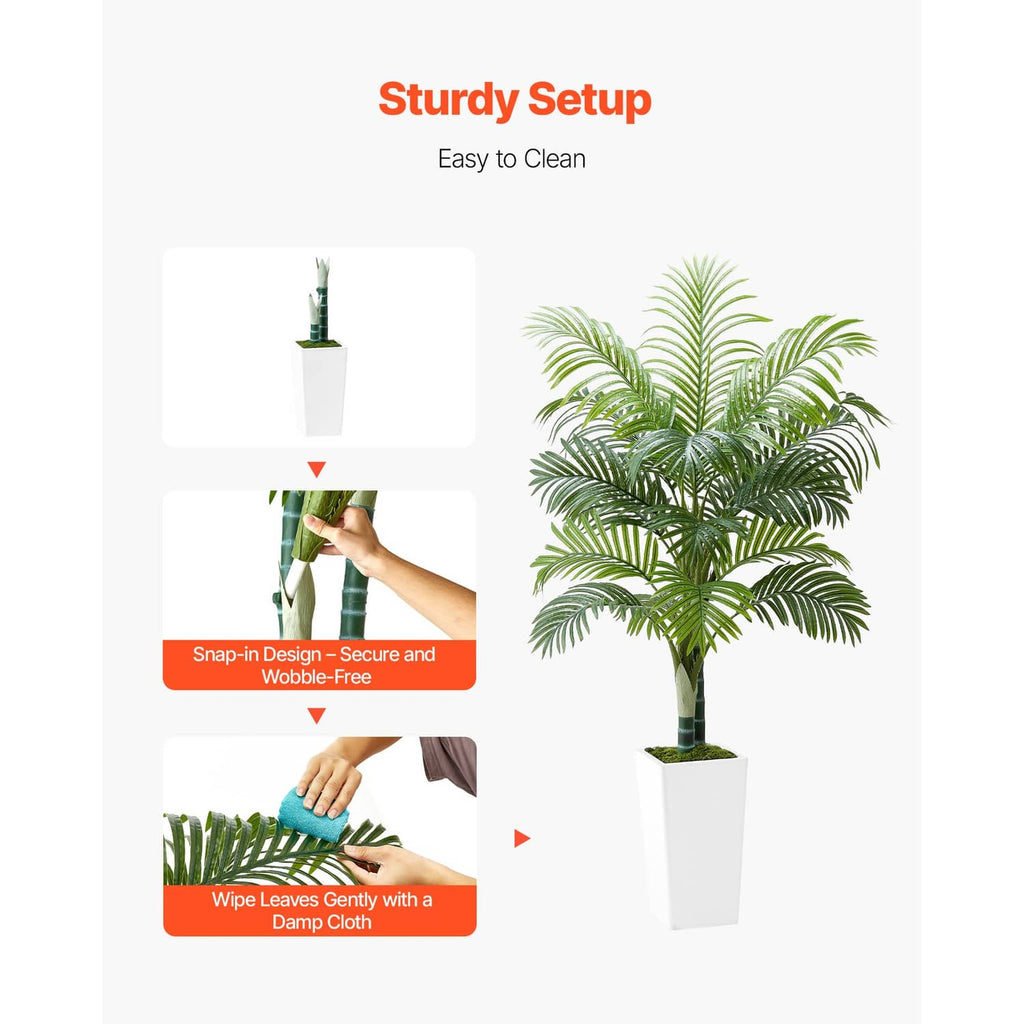 Faux areca palm tree in white pot with green leaf fronds and trunk