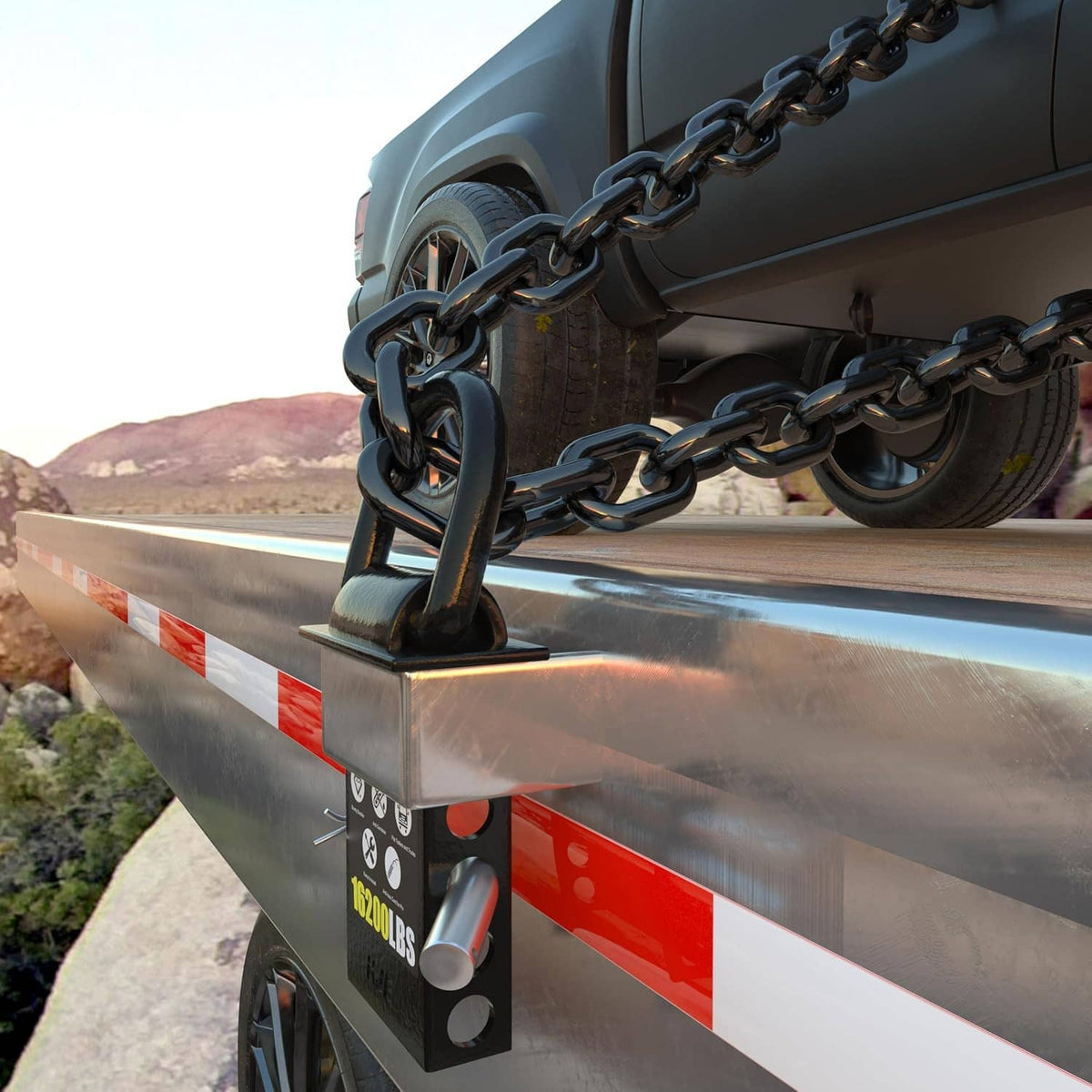 Black D-ring stake pocket anchor mounted on trailer rail with chain attachment
