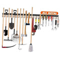 Metal garden tool organizer rack with multiple hooks holding shovels, rakes, and hand tools