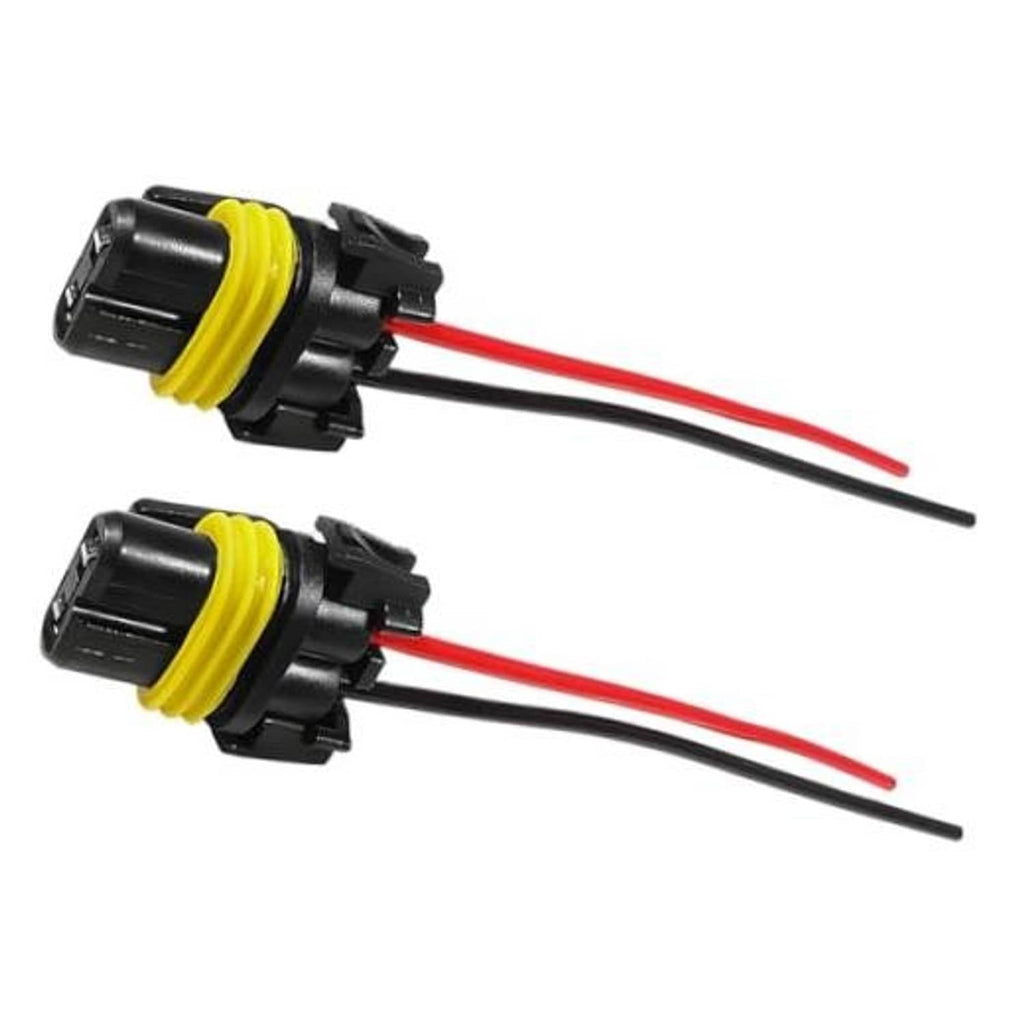 Pair of car headlight wiring harness connectors with yellow-black sockets and red/black wires