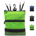Bright green golf pouch bag with three zipper pockets and carabiner clip, holding pencils