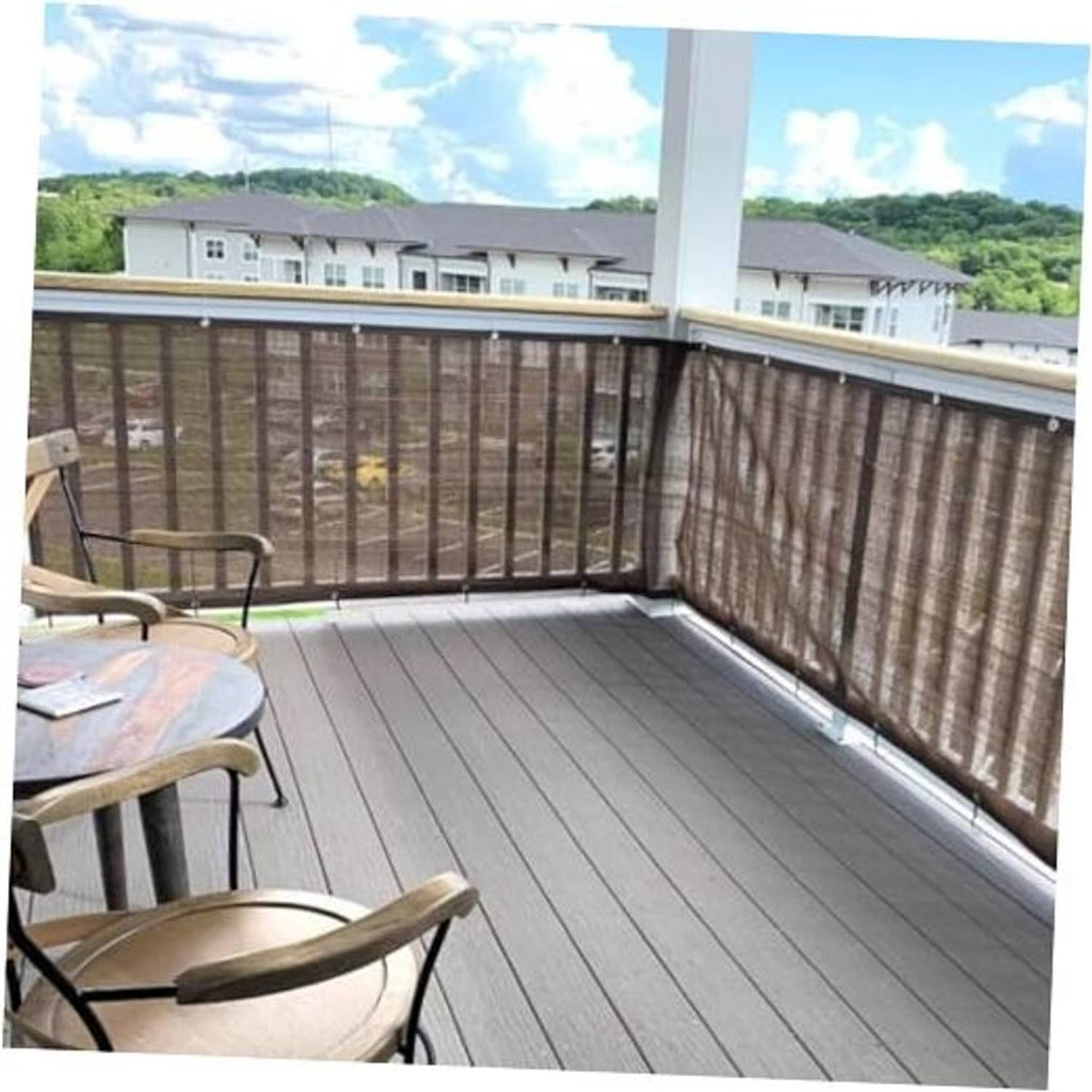 Brown woven privacy screen fabric mounted to a balcony railing