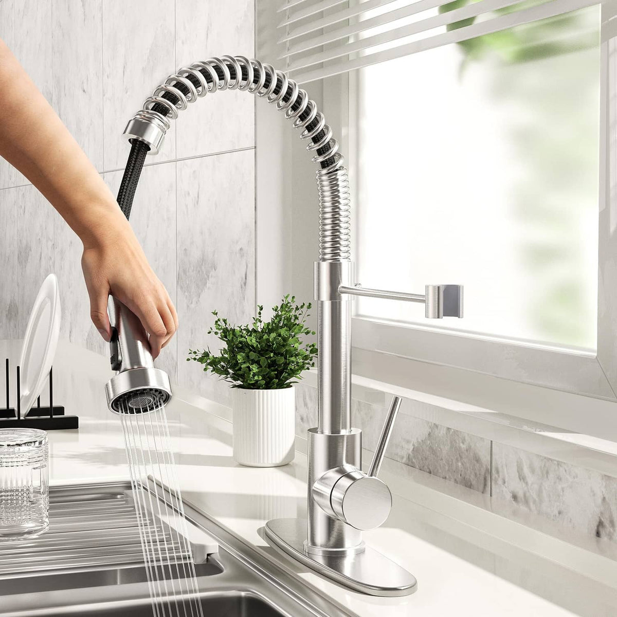 Brushed nickel kitchen faucet with pull-down sprayer and side-mounted lever