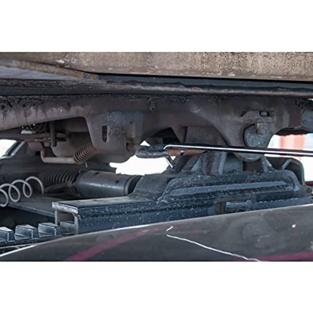 Chrome 5th-wheel pin puller in use near coupler hardware, long pull bar