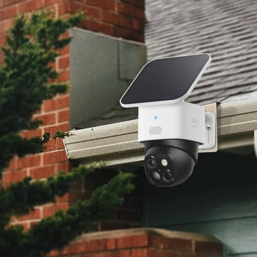 Stainless steel gutter camera mount bracket holding a dome security camera under eave