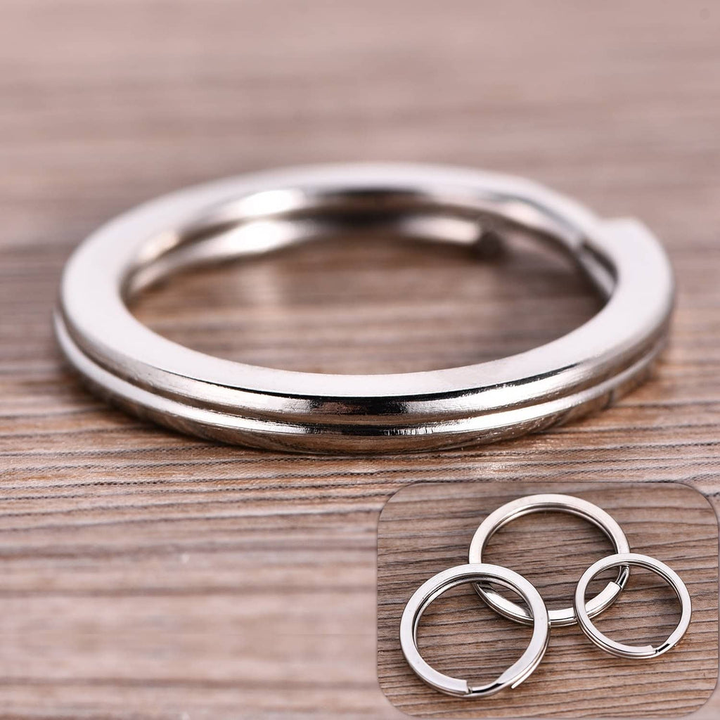 Stainless steel round ID tag rings, stacked with a few loose rings