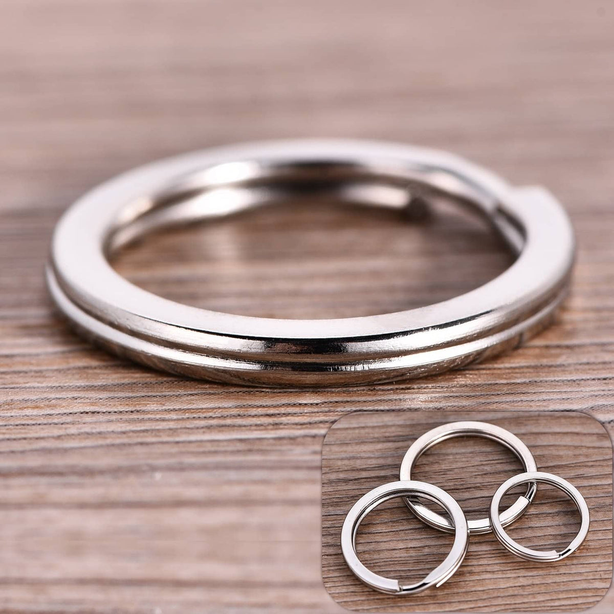 Stainless steel round ID tag rings, stacked with a few loose rings