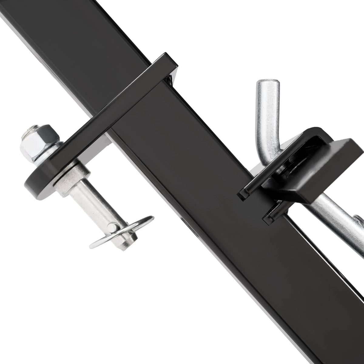 Close-up of hitch pins and black scraper blade support bar with clevis hardware