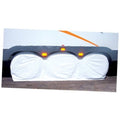 Small triple-axle wheel cover with three amber reflectors and white protective pads