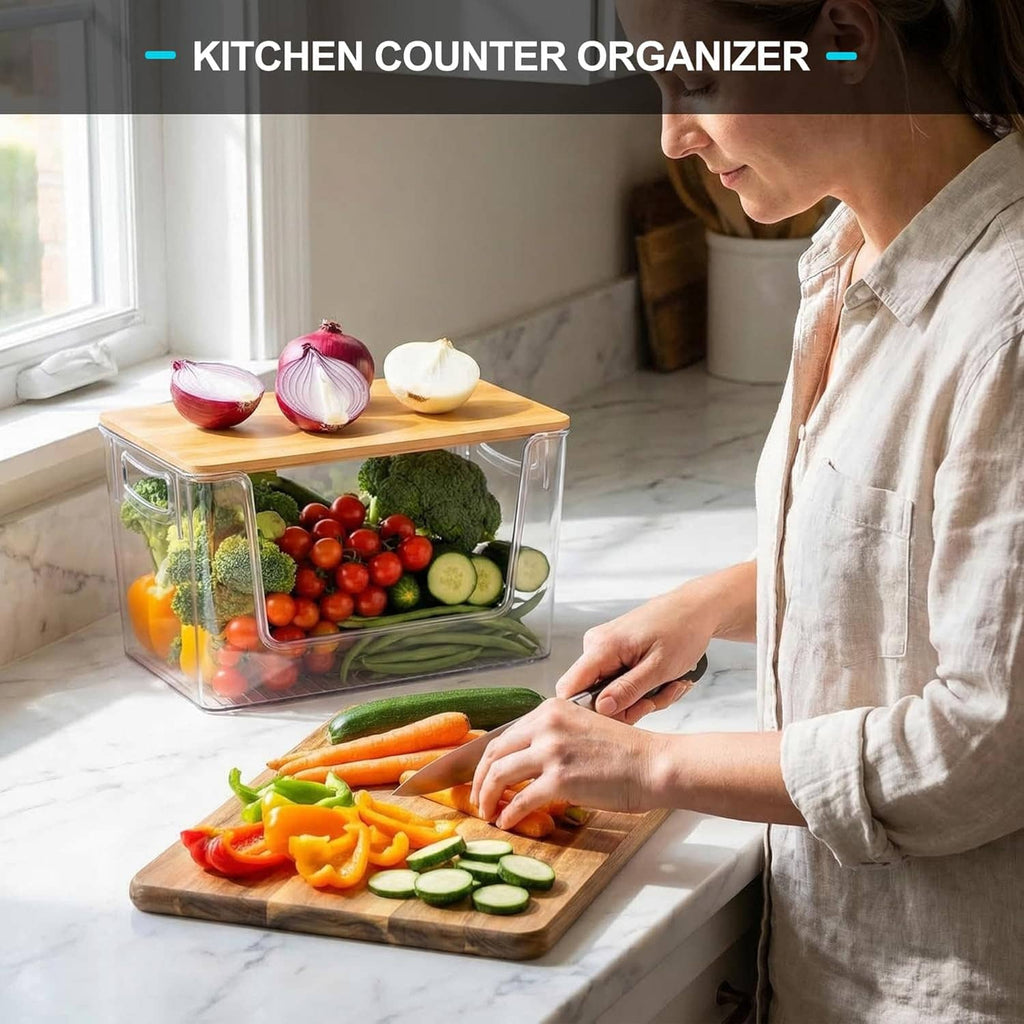 Clear kitchen counter organizer bin with bamboo lid holding fresh vegetables and cuttings