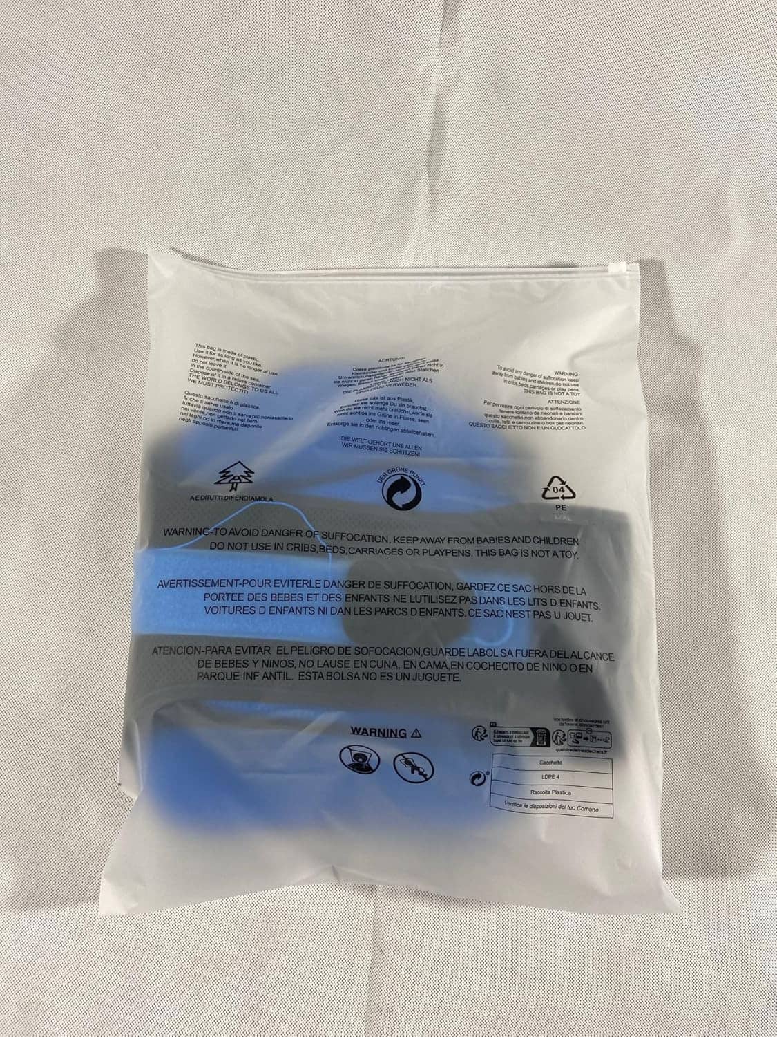 Lumbar support belt package back side with warning icons and instruction text