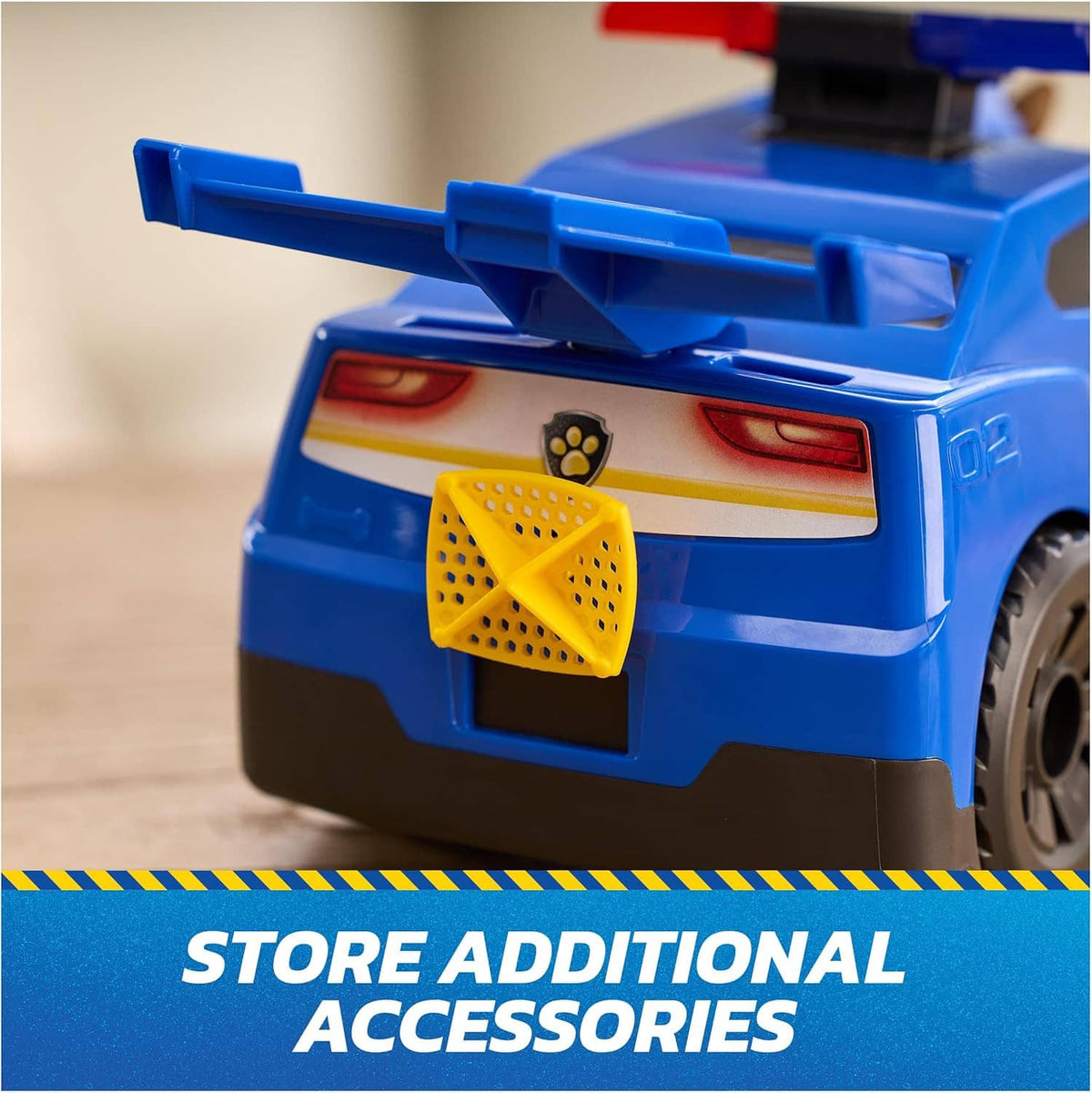 Paw Patrol blue rescue cruiser toy car back with yellow accessory holder and tail details